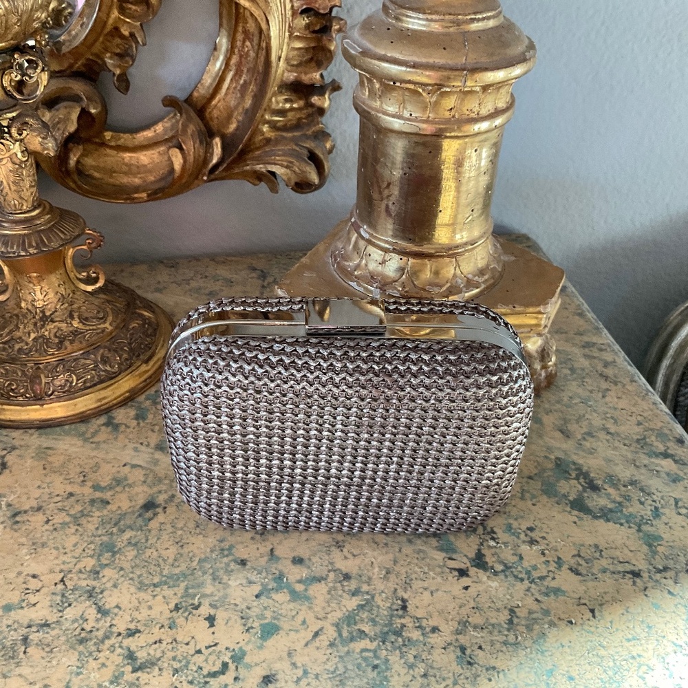 Expressions NYC textured clutch with metal accents